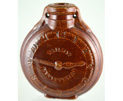 DATED RAILWAY CHRONOMETER FLASK. 5ins tall, brown salt glaze flask, clock numbers to front. Base impressed RAILWAY/ CHRONOMET