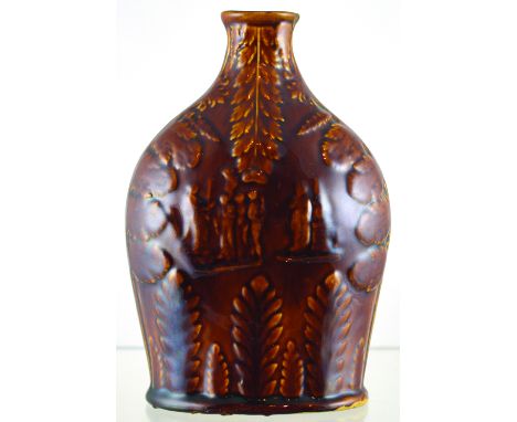 FLASK. 7.5ins tall, shiny brown glaze flask with raised decoration, figures both sides with leaf design all over. Flake to si