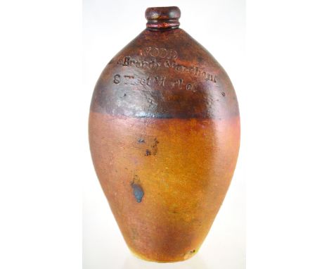 FLEET MARKET VERY EARLY FLASK. 9.5ins tall, flattened round shouldered flask, impressed WOOD/ WINE &amp; BRANDY MERCHANT 8 FL