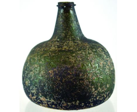 ENGLISH ONION WINE BOTTLE. 6.25ins tall, dark olive green glass. Short tapered neck, remains of string rim, base pontil. All 