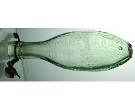 PATENT LONDON HAMILTON BOTTLE. 7.5ins long, aqua glass embossed COHEN BROS/ CALEDONIAN ROAD/ CAMBERWELL large lion t.m. to re