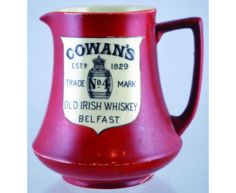 COWANS BELFAST PUB JUG. 5ins tall, brown body, black transfer on white COWANS/ ESTD 1829/ TRADE NO 4 MARK/ OLD IRISH WHISKEY/