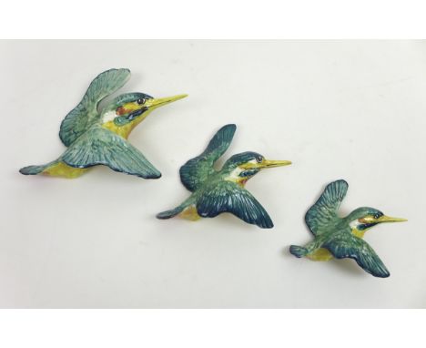 A group of three Beswick ceramic wall plaques, each modelled as a kingfisher, of graduating size, stamped '729-1', '729-2' an