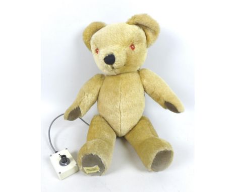 A vintage Merrythought talking bear, with lead attached controller, plush fur, plastic light up eyes, 48cm. 