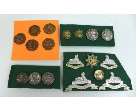 A collection of WWI and later British army and RAF cap badges and buttons, including Lincolnshire Rifle Volunteers, Lincolnsh