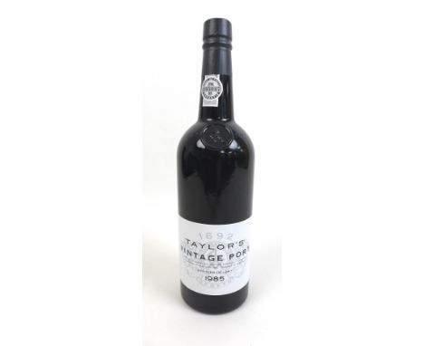A bottle of 1985 Taylor's Vintage Port, U: above shoulder. 