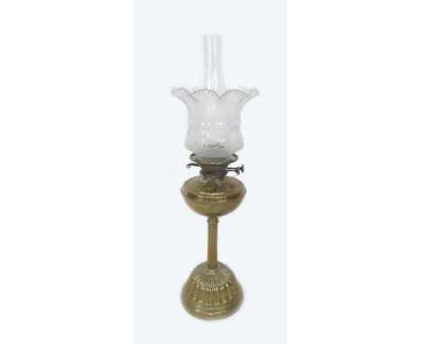 A Victorian Duplex oil lamp, with brass well, etched glass shade and plain glass chimney, overall height 19 by 65cm high. 