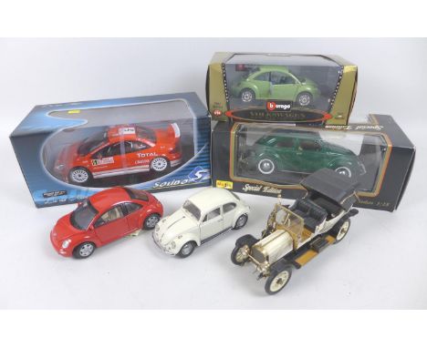 A collection of six model cars, comprising Franklin Mint 1:24, 1967 Volkswagen Beetle in grey, The Volkswagen New Beetle in r