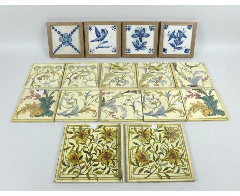 A collection of sixteen tiles, comprising four 19th century Delft blue and white tiles, set into wooden frames, a pair of Vic