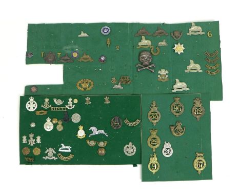 A collection of over sixty British army badges and buttons, including a some late 19th century style cap badges including 9th