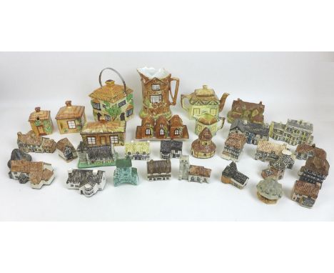 A large collection of ceramic buildings, prominently from the 'Britain in Miniature' series from the East Anglian area, toget