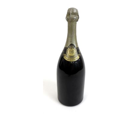 A bottle of Moet & Chandon 1943 Coronation Cuvee vintage champagne, released in 1953 for Elizabeth II coronation,  some damag