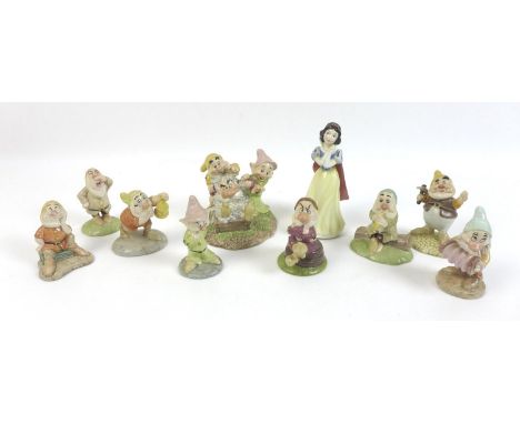 A group of Beswick Snow White &amp; the Seven Dwarf figurines, comprising Snow White SW9, Happy SW12, Grumpy SW11, Sleepy SW1