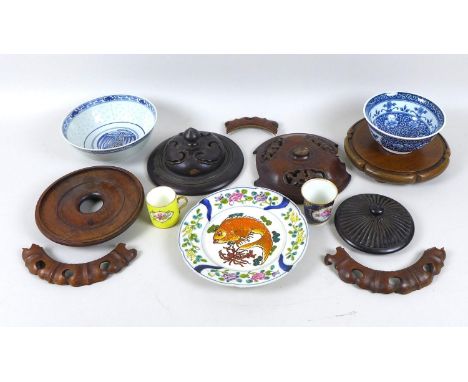 A group of three Chinese hardwood lids, largest 20cm, two hardwood stands, largest 20.5cm, two Chinese modern blue and white 