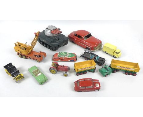A collection of eleven playworn vintage model vehicles, comprising a Dinky Massey harris tractor, a Dinky Cadillac El Dorado,