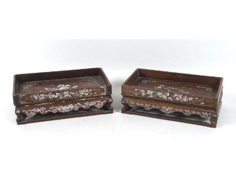 A near pair of Chinese hardwood inlaid trays on stands, early 20th century, of rectangular form with shaped aprons and short 