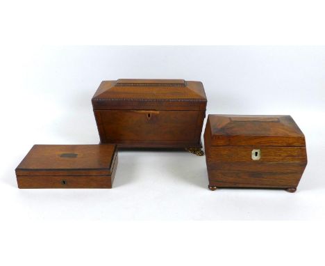 A group of three 19th century wooden boxes, comprising a sarcophagus shaped tea caddy with lion's mask ring handles and hairy