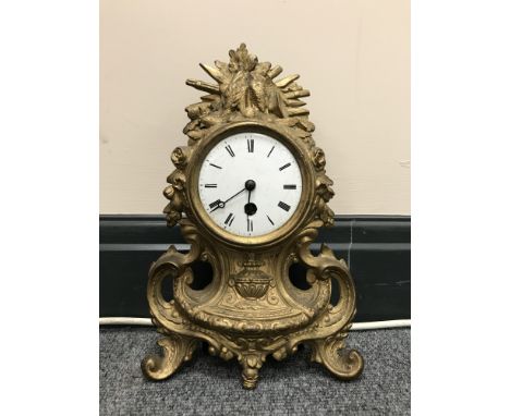 An early 20th century French gilt mantel clock with enamelled dial 
