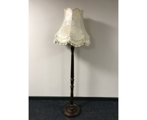 A contemporary standard lamp with shade 