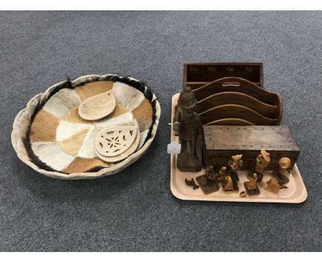 A tray containing a letter rack, a Victorian trinket box, Eastern figures, together with a hide covered bowl