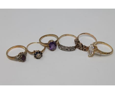 A 9ct gold amethyst and diamond ring, another 9ct gold amethyst set ring, three 9ct gold dress rings and a sapphire and diamo