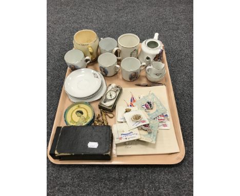 A tray containing a boxed camera, a boxed pocket compass, together with a quantity of commemorative ware including pin badges