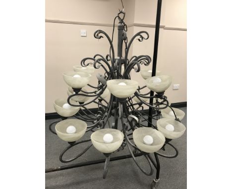 An impressive bespoke metal multi-branch chandelier with eighteen marbled glass shades 