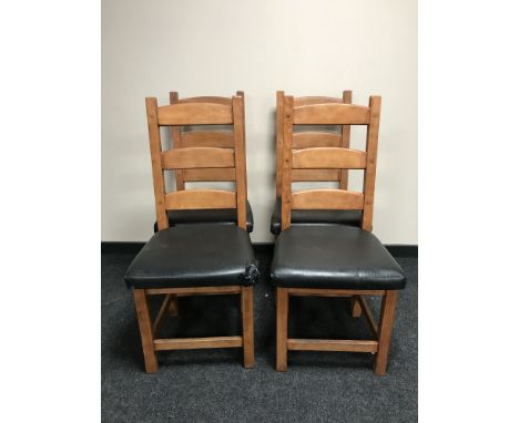 A set of eight pine ladder back dining chairs 