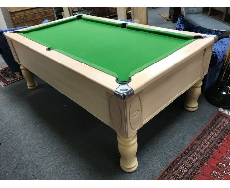 An Ascot six foot pool table, slate bed, not coin operated, complete with novelty 8 ball que stand, twelve cues ,one set of p