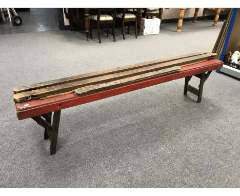 A mid 20th century folding bench together with a tapestry frame
