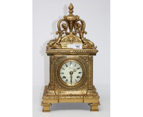 A brass striking eight day mantel clock
