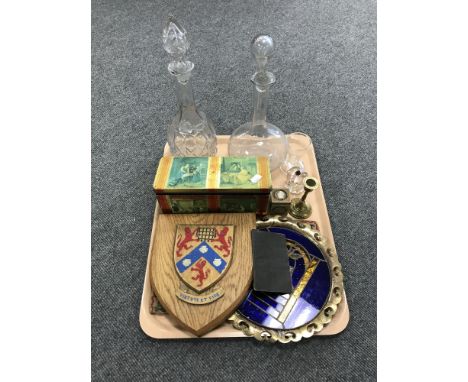 A tray consisting of metal embossed trinket boxes, a miniature Huntley and Palmer biscuit tin, decanters, an unframed sampler