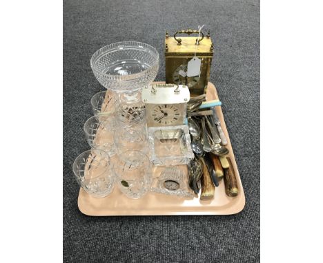 A tray of assorted cutlery, two battery operated carriage clocks, Waterford crystal mantel clock, set of six Webb crystal tum