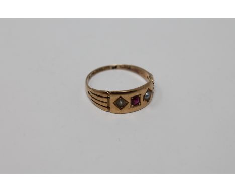 A 15ct gold ruby and pearl ring CONDITION REPORT: The ring weighs 2.8g. The ruby measures 2.40mm by 2.65mm from above. The de
