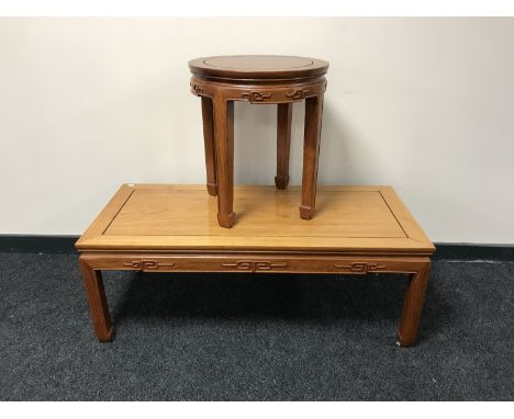 An oriental style rectangular hardwood coffee table together with circular lamp table 
