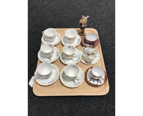A tray of Hummel figure, six Royal Doulton The Picardy cups and saucers, miniature china tea service, Oriental cups and sauce