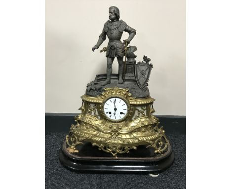 A French brass and spelter mantel clock with enamelled dial on wooden plinth 