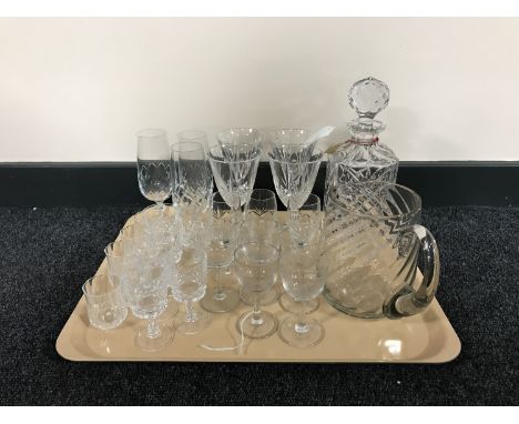 A tray of crystal decanter, antique hand blown glass jug, drinking glasses etc 
