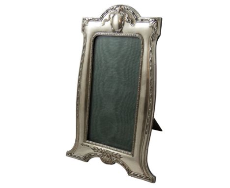 An Art Deco silver photograph frame, Birmingham 1947, of rectangular form with engine turned decoration, wooden easel, height