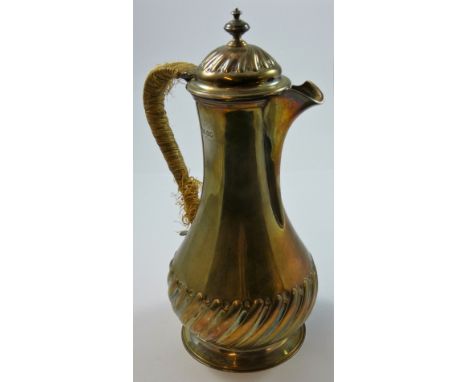 A Victorian silver hot water pot, London 1888, of half fluted baluster form with vase finial, height 22.5 cm, weight 13 oz.