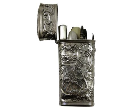A George II silver etui, apparently unmarked, c.1790, the tapering body with embossed shell and scroll decoration, opening to