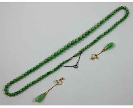 A jade bead necklace, untested, composed of graduated 8 - 4 mm beads, length 50 cm, together with a pair of jade, untested, t