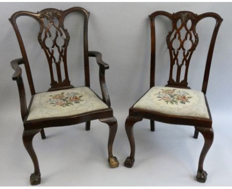 A set of six mahogany Chippendale style dining chairs, with carved splats, cabriole legs terminating in ball and claw feet, d