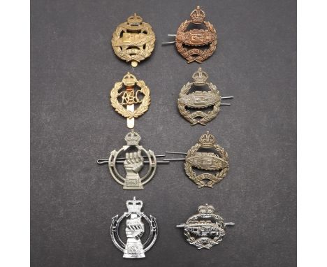 A COLLECTION OF TANK CORPS AND ROYAL TANK CORPS CAP BADGES. A collection of eight badges including a First World War cap badg