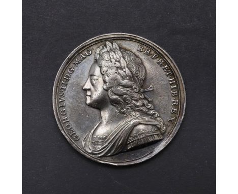 A GEORGE II CORONATION MEDAL, 1727. A George II Coronation Medal 1727 by J. Croker, laureate and draped bust l. Reverse the k
