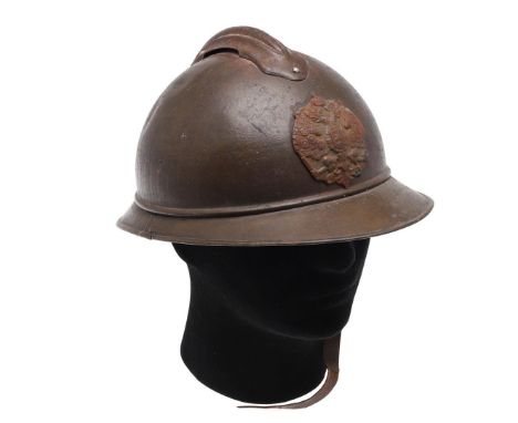 A RUSSIAN M15 PATTERN ADRIAN HELMET. An M15 pattern helmet painted a light brown colour with a helmet plate with Imperial Rus