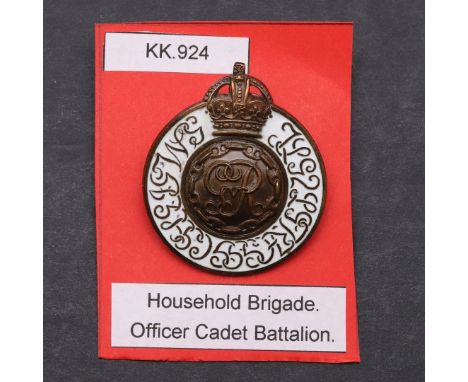 A GEORGE V HOUSEHOLD BRIGADE OFFICER CADET BATTALION CAP BADGE. A Cadet Battalion Household Brigade cap badge with white enam