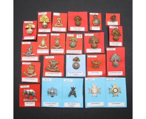 A COLLECTION OF TWENTY TWO BADGES FOR VARIOUS DRAGOON, FUSILIER AND HUSSARS REGIMENTS. A collection of badges for the 1st Que