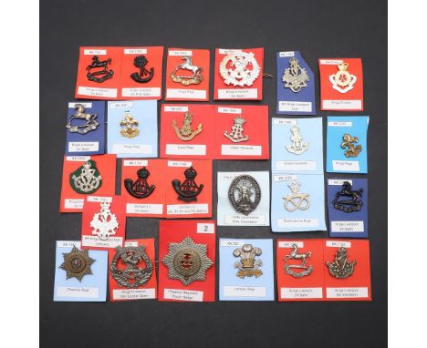 A COLLECTION OF TWENTY FIVE BADGES FOR LIVERPOOL AND SIMILAR REGIMENTS. A collection of badges for the King's Liverpool Regim