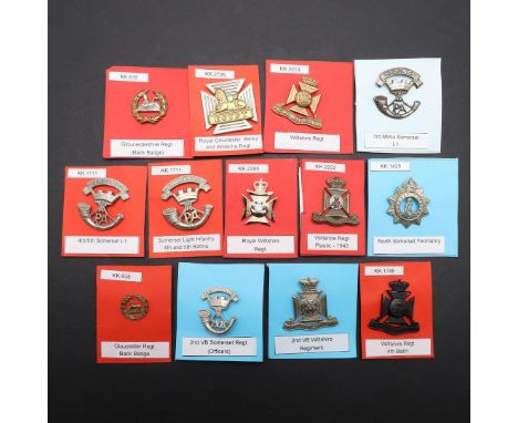 A COLLECTION OF THIRTEEN BADGES FOR SOMERSET, WILTSHIRE AND GLOUCESTER REGIMENTS. A collection of badges for the Somerset, Wi